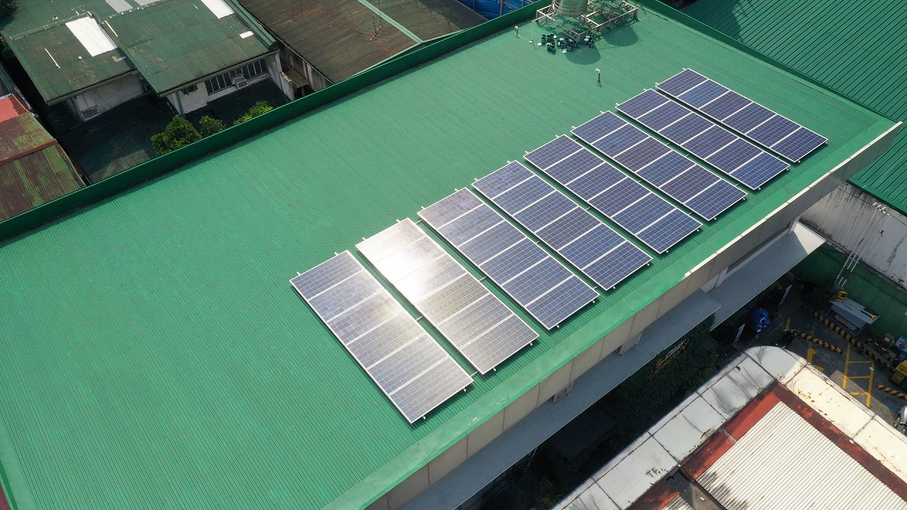 Top shot of a solar panel with sunlight bouncing off of it