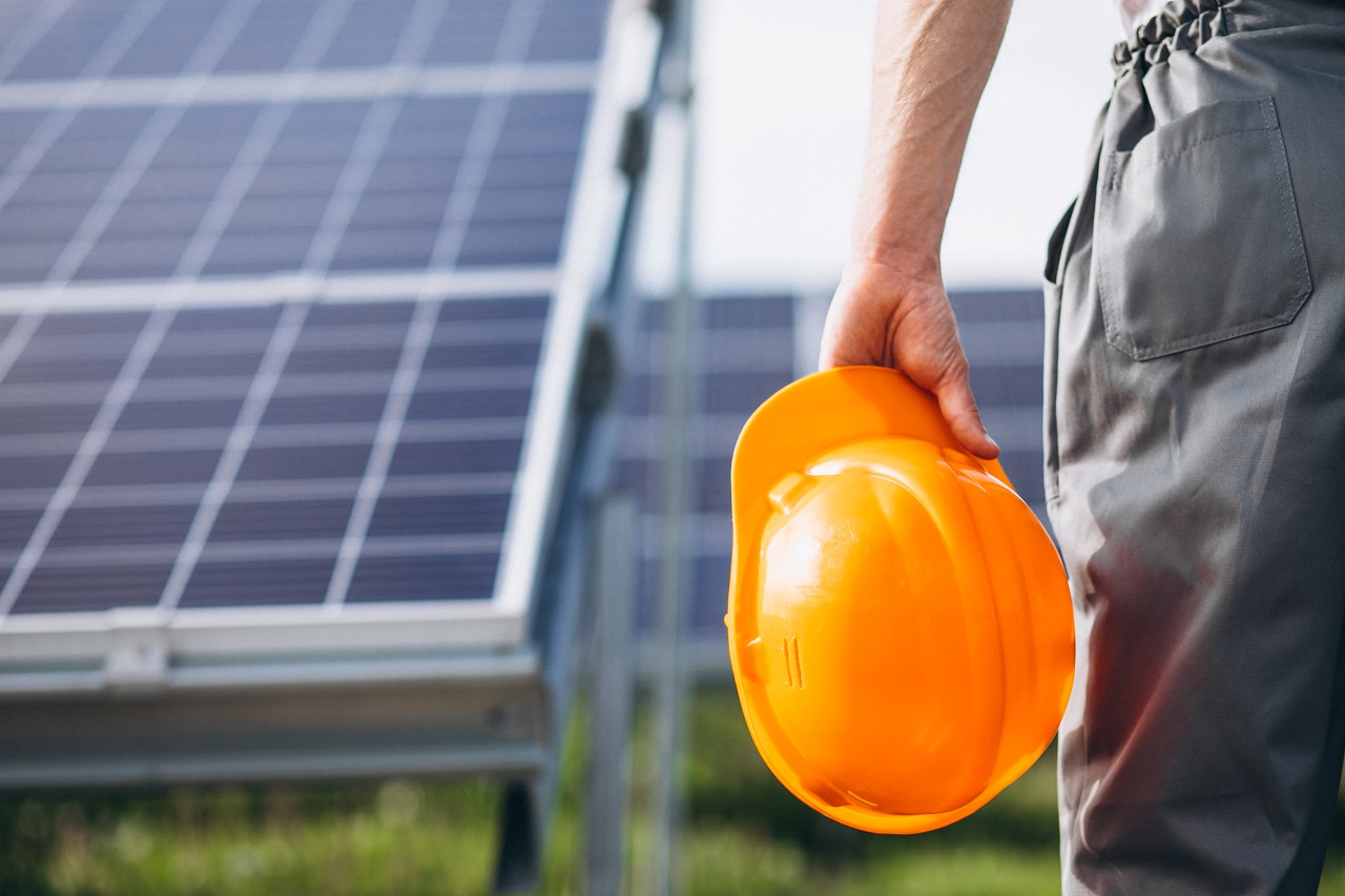 A worker installing solar panels