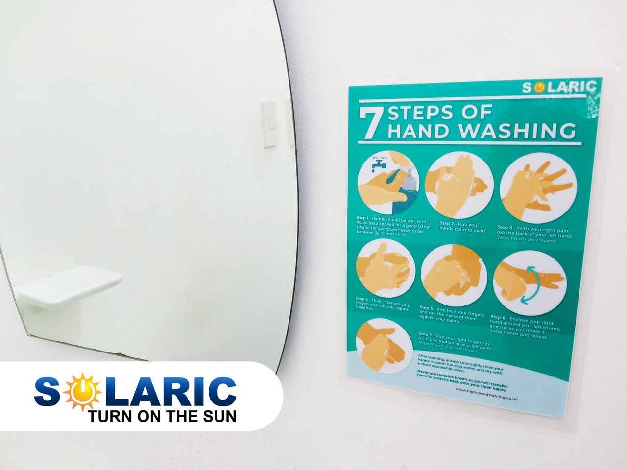 An infographic stuck to a bathroom wall on how to wash hands