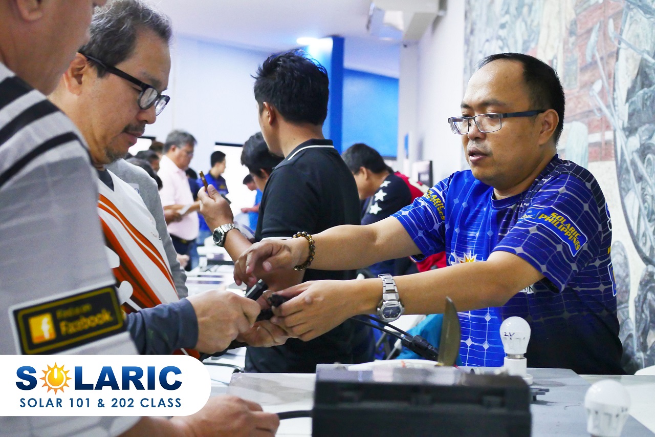 A solar professional teaching the specifics of the equipment