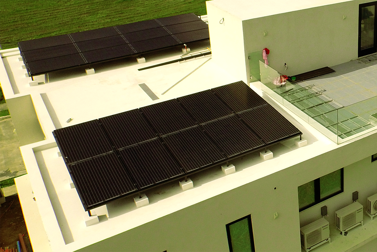 Solar panels on top of a house with a small rooftop