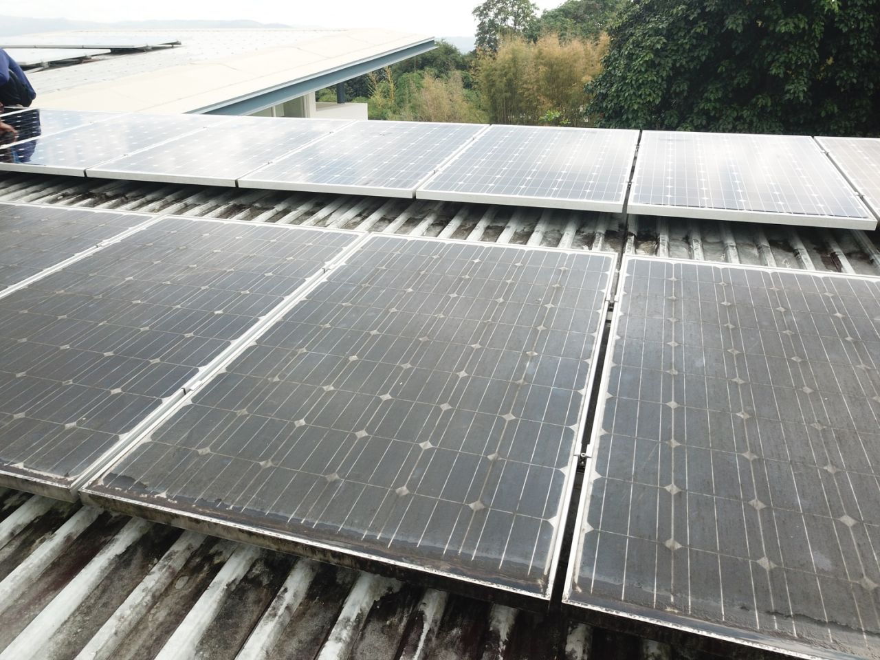 Solar panels with volcanic ash on it