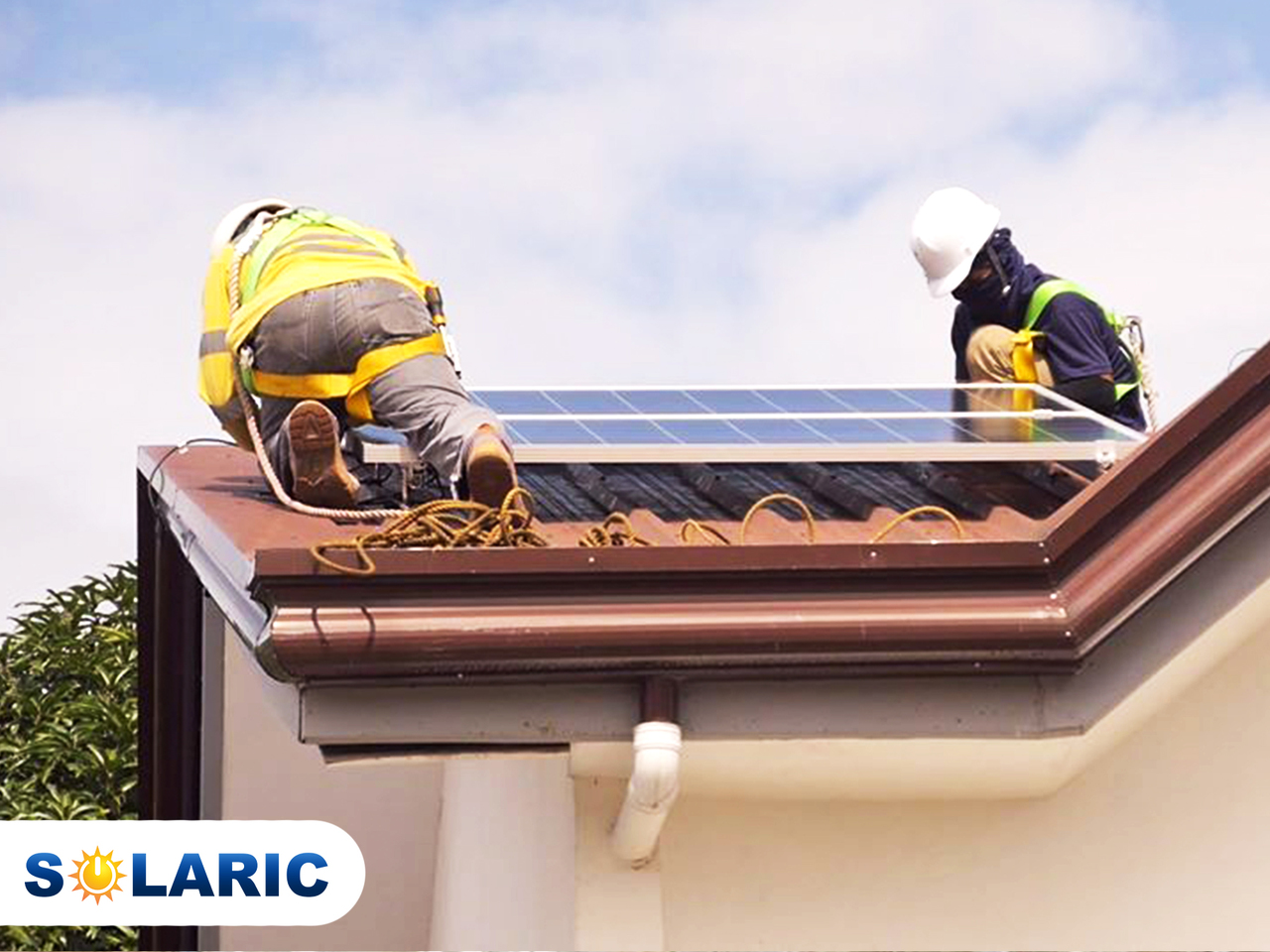 Solaric workers installing solar roofing