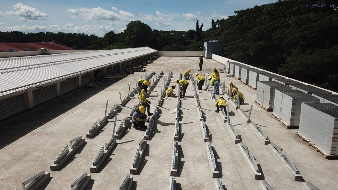 A team installing solar on a rooftop
